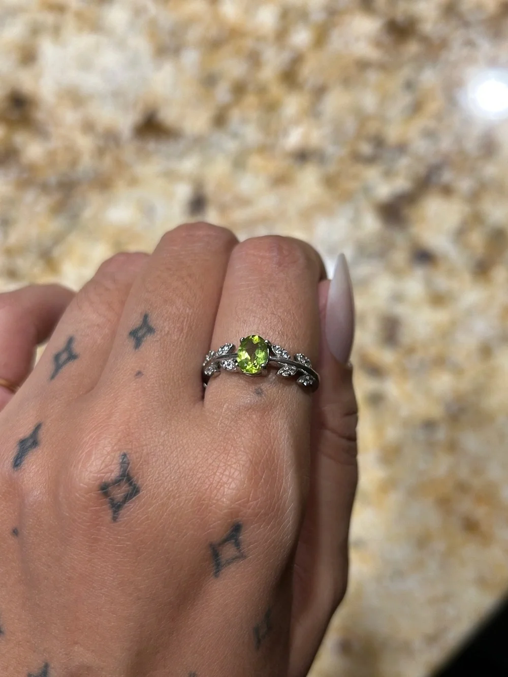 Sterling Silver Peridot Ring with Leaf Accent